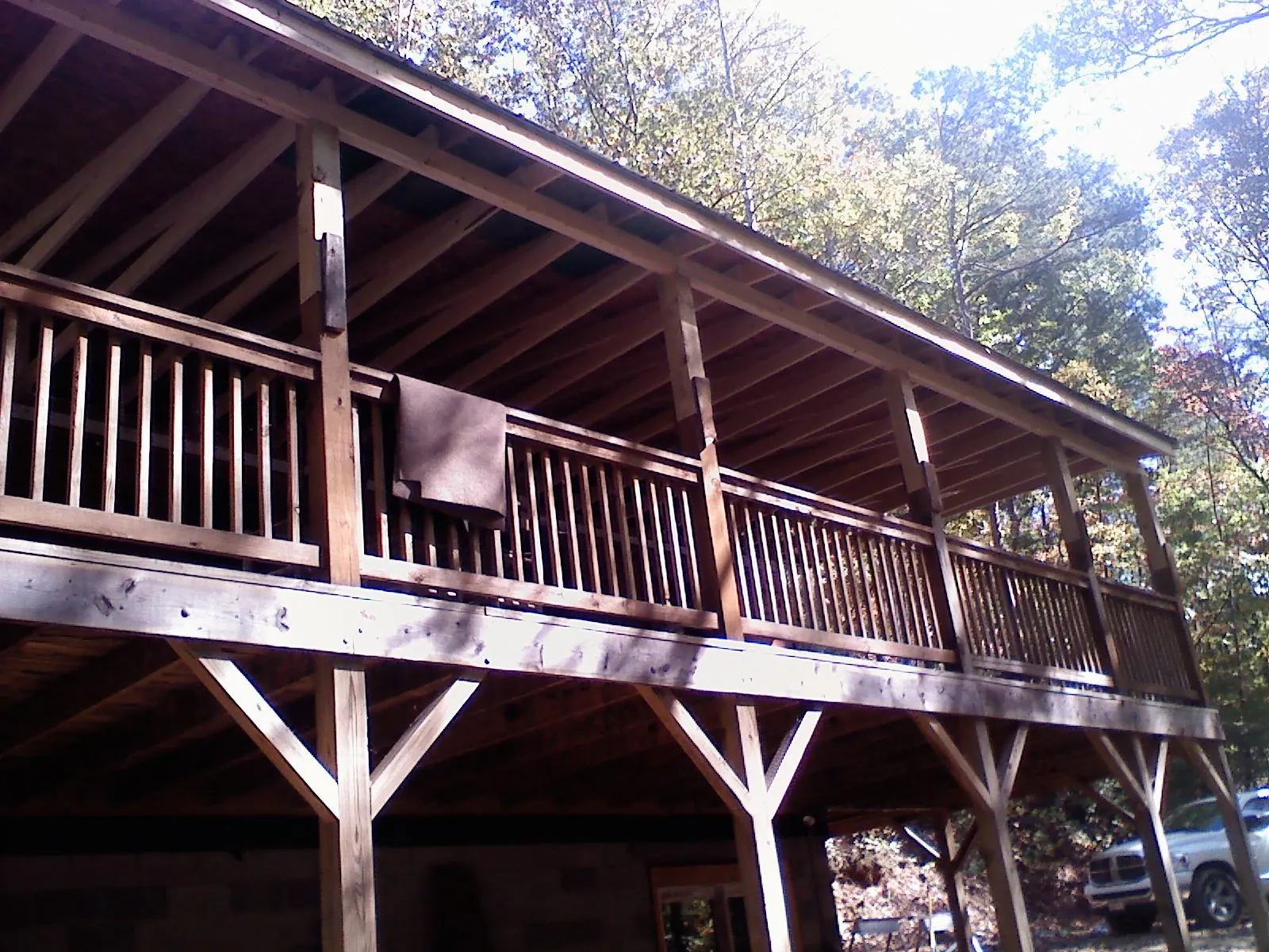 Timber framing under a new elevated porch and deck — Roof Leak Repair in Pentwater by Roofing Brothers
